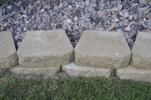 Wraparound Retaining Wall With Stone Plant Beds